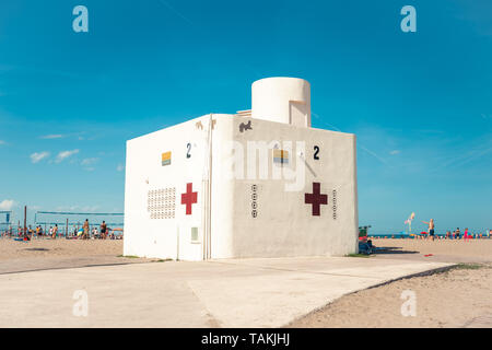 Valencia,Spain - May 26, 2019: Red cross lifeguard building at the beach. Valencia, Mavarrosa beach. Stock Photo