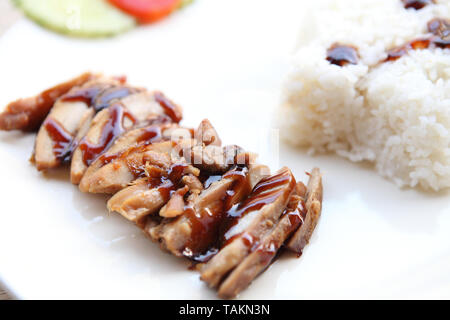 Grilled Chicken teriyaki rice on wood background Stock Photo