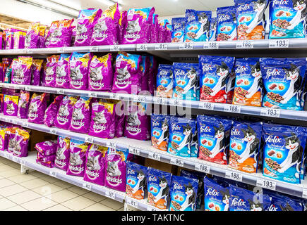 Samara, Russia - May 26, 2019: Various fresh cat food ready for sale on supermarket shelves. Cat food as background Stock Photo