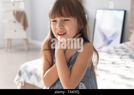 Little girl having asthma attack at home Stock Photo