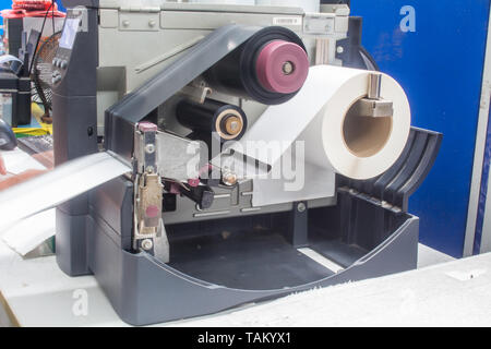 Barcode printer and barcode label with ribbon technology printer. Stock Photo