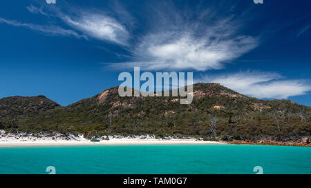 Wineglass Bay, Freycinet National Park, Beach, sky and Clouds with Turquoise Sea Stock Photo