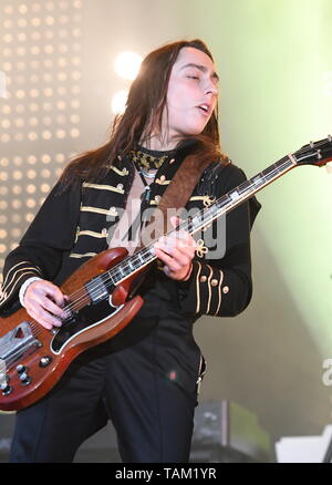 Guitarist Jake Kiszka is shown performing stage during a 'live' concert appearance with Greta Van Fleet. Stock Photo