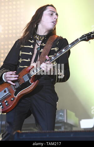 Guitarist Jake Kiszka is shown performing stage during a 'live' concert appearance with Greta Van Fleet. Stock Photo