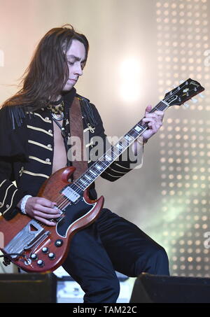 Guitarist Jake Kiszka is shown performing stage during a 'live' concert appearance with Greta Van Fleet. Stock Photo