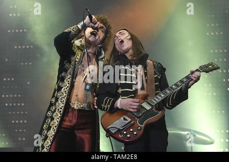 Brothers Josh and Jake Kiszka are shown performing together on stage during a 'live' concert appearance with Greta Van Fleet. Stock Photo