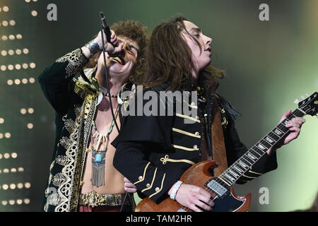 Brothers Josh and Jake Kiszka are shown performing together on stage during a 'live' concert appearance with Greta Van Fleet. Stock Photo