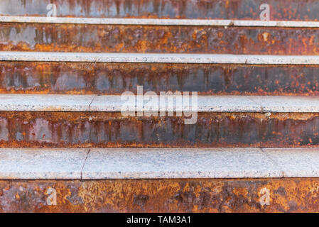 rusty staircase with streaks. Orange staircase. Stock Photo