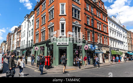 A bicolour building with a chamfered corner, Old Compton street and ...