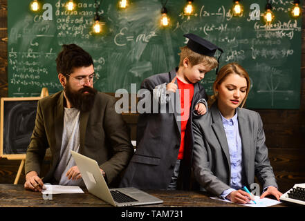 Students are communicating on regular basis with the tutor. University male speaker conducts business training. Awesome teachers know about things Stock Photo