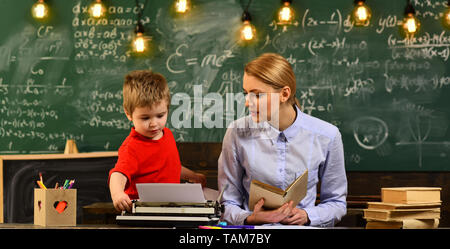 Friendly teacher and adult smiling student in classroom, Good teachers seek engaged students, Digital education online studying internet school Stock Photo