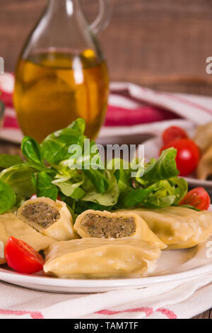Maultaschen - swabian filled pasta ( ravioli ). Stock Photo