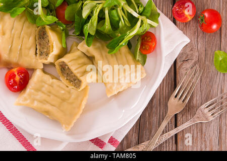 Maultaschen - swabian filled pasta ( ravioli ). Stock Photo