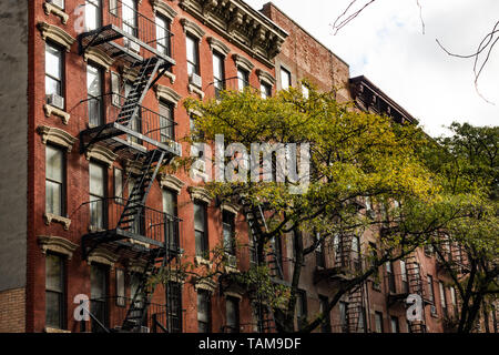 Close-up view of New York City style apartment buildings with emergency stairs along Mott Street in Chinatown neighborhood of Manhattan, New York, USA Stock Photo