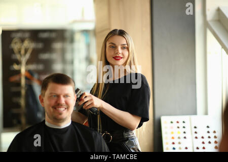 Young Girl Hairstylist Shave Smiling Male Client Stock Photo