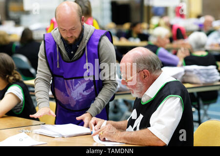 Hereford, UK. 26th May, 2019. Election staff count ballot papers in Hereford as part of the UK wide European Elections - The Hereford votes are part of the West Midlands region and will return 7 MEPs - overall the UK will return 73 MEPs to the European Parliament. Credit: Steven May/Alamy Live News Stock Photo