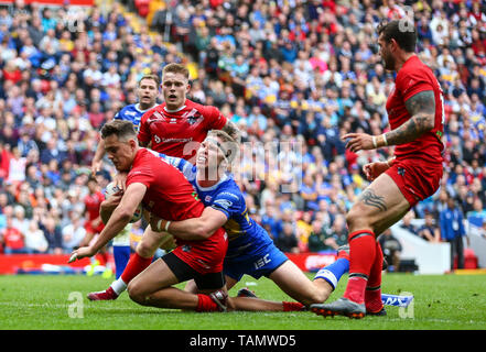 Anfield, Liverpool, UK. 26th May, 2019. Rugby League Dacia Magic Weekend; Alex Walker of London Broncos scores a try in the 74th minute to make it 24-20 with Matt Parcell of Leeds Rhinos trying to stop the effort Credit: Action Plus Sports/Alamy Live News Stock Photo