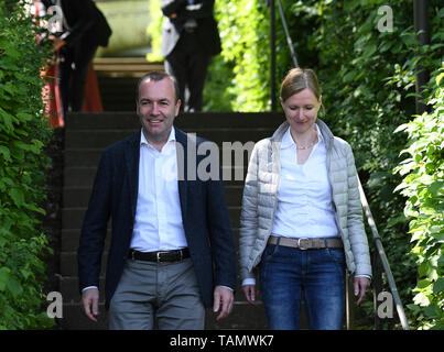 Wildenberg, Germany. 26th May, 2019. Manfred Weber (L), the top candidate of the European People's Party (EPP) for the European elections, goes to a polling station in Wildenberg, Germany, on May 26, 2019. Voters in Germany cast their ballots on Sunday in elections to the European Parliament (EP). Credit: Lu Yang/Xinhua/Alamy Live News Stock Photo