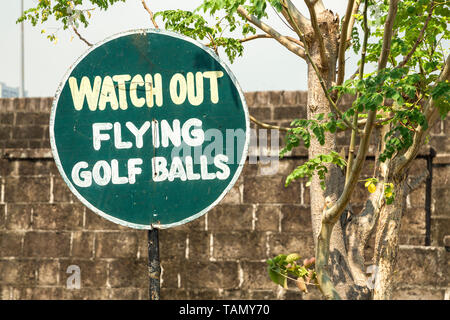 Funny sign Watch out, flying golf balls in the golf course Stock Photo