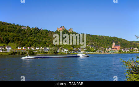 Cargo ship on the Rhine river at Oberwesel, above the Schönburg castle, Upper Middle Rhine Valley, Rhineland-Palatinate, Germany Stock Photo