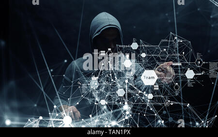 Hacker in hoodie dark theme Stock Photo