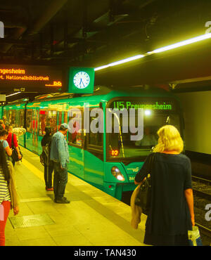 FRANKFURT AM MAIN, GERMANY - AUGUST 31, 2018: Train arriving to crowded subway platform, Frankfurt, Germany Stock Photo