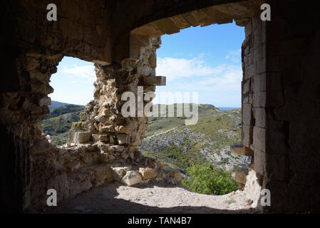 View over the Alpilles Hills through an Old Window in the Castellas or Château de Roquemartine Castle Eyguières Alpilles Provence France Stock Photo