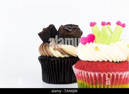 Chocolate and rainbow cupcake isolated on white background Stock Photo