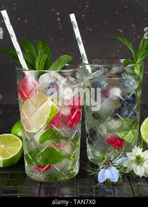 Mojito is a cocktail made with white rum, sugar, lime juice, soda water, and mint Stock Photo