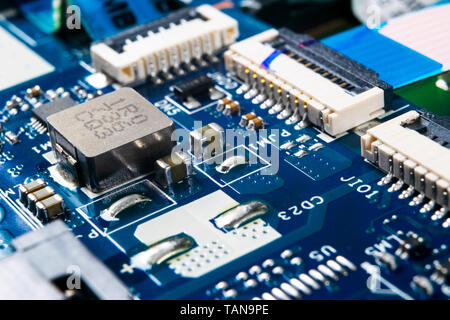 Macro shot of Circuit board with resistors microchips and electronic components. Computer hardware technology. Integrated communication processor. Inf Stock Photo