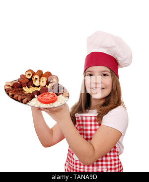 happy little girl cook with mixed grilled meat Stock Photo