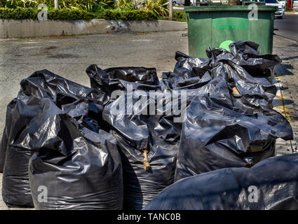 Street city trash bags Stock Photo