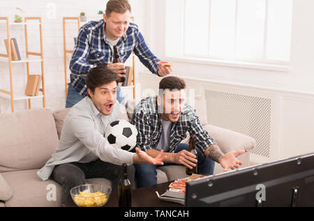 Lost Game. Angry Football Fans Watching Match At Home Stock Photo