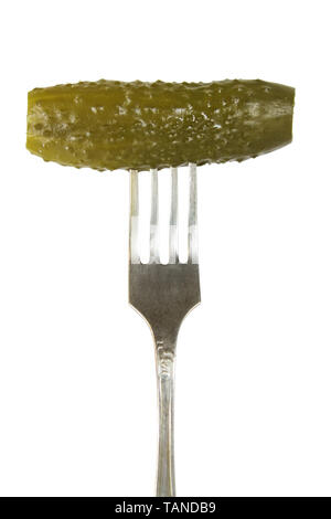 Pickled cucumber on a fork isolated on white Stock Photo