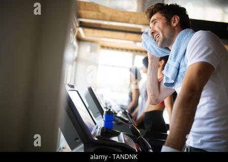 Handsome sporty man resting, having break doing exercise Stock Photo