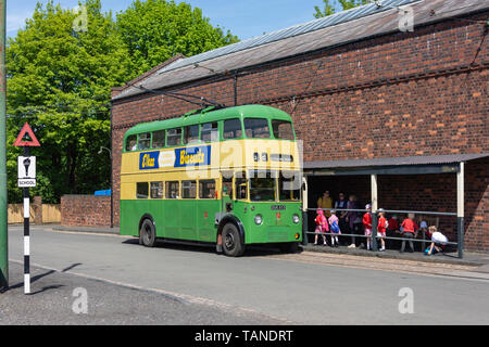 Schoolchildren boarding vintage double-decker tram in Black Country Living Museum, Dudley, West Midlands, England, United Kingdom Stock Photo