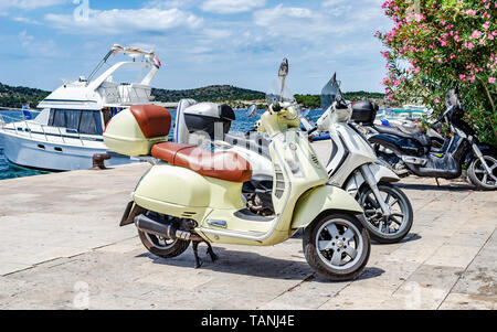 Scooter on the parking in the city. Stock Photo
