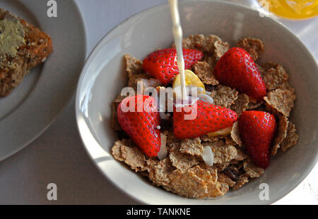 A healthy breakfast of bran flakes and strawberries Stock Photo