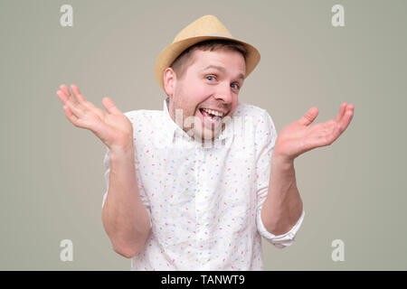 Funny young tourist man who cares so what, I do not know. Stock Photo