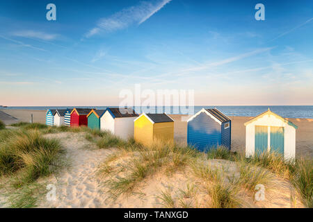 Beach huts in sand dunes at Southwold on the Suffolk coast Stock Photo