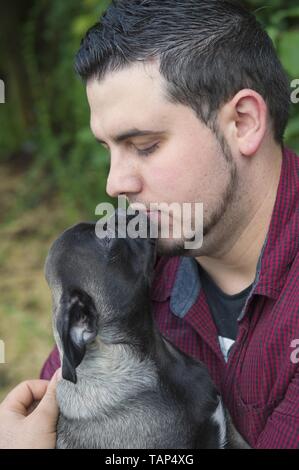 man and pug Stock Photo