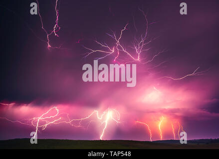 Lightning with dramatic clouds composite image . Night thunder-storm in Lithuania Stock Photo