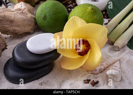 Spa concept with flower and zen pebbles Stock Photo