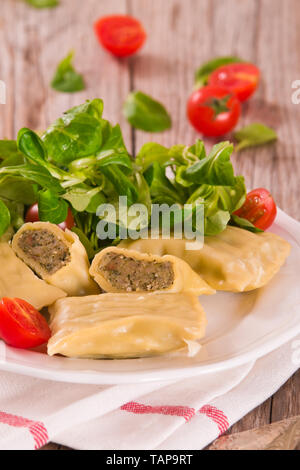 Maultaschen - swabian filled pasta ( ravioli ). Stock Photo