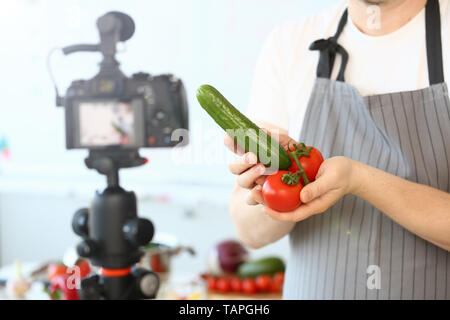 Comic Culinary Blogger Holding Organic Vegetables Stock Photo