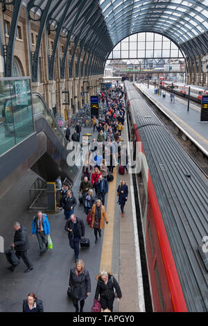 Passengers leaving a LNER, London North eastern railway train at London Kings Cross Stock Photo