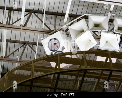 Large White Speakers Suspended From Church Ceiling Stock