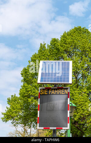 Radar speed sign with solar panel, Germany Stock Photo