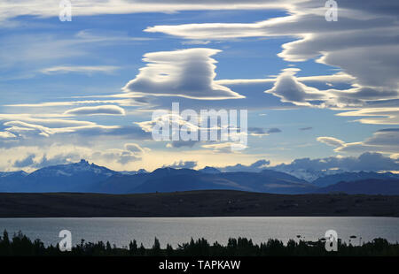 Stunning view of Lenticular clouds on the evening sky over Argentino lake in El Calafate, Patagonia, Argentina, South America Stock Photo
