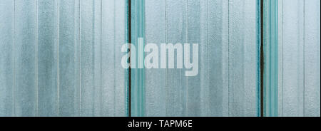 Opaque striped glass wall blocks. Architecture detail. Wide-angle background from vertical strips. Big translucent brick. Abstract blue grainy texture. Stock Photo